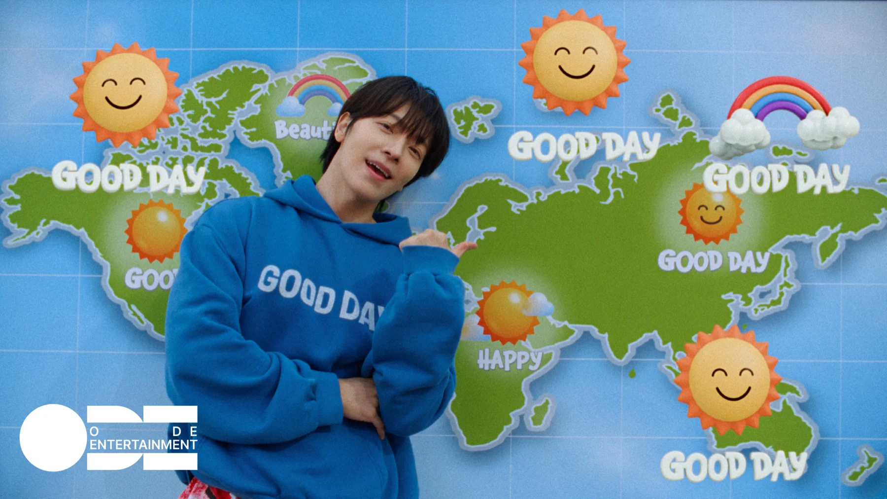 Still from the Good Day music video, blue sky, globe, warm light